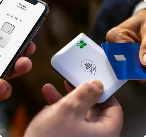 Clover Go card reader paired with a phone